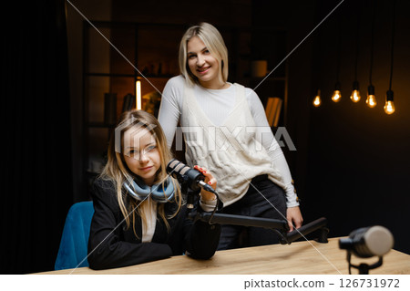Two podcasters gesturing ok sign during a live recording Two podcasters gesturing ok sign during a live recording 126731972