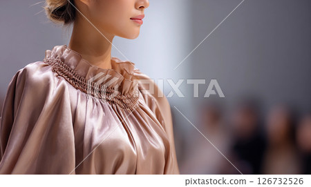 girl model on the catwalk at a fashion show in a stylish dress of the trendy color 2025 mocha mousse 126732526