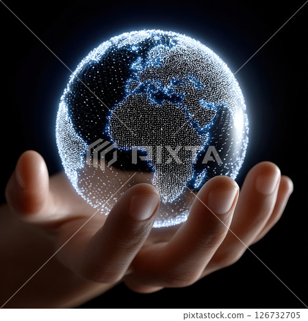 A glowing digital earth is held in a person's hand, representing global connections. 126732705