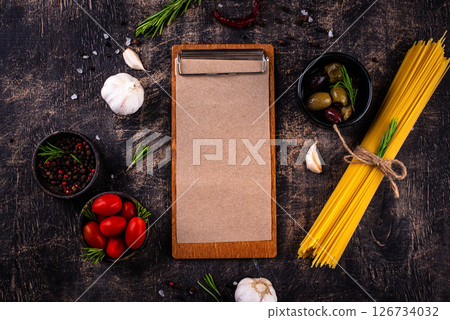 Italian food background with spaghetti, tomato and spices Italian food background with spaghetti, tomato and spices 126734032