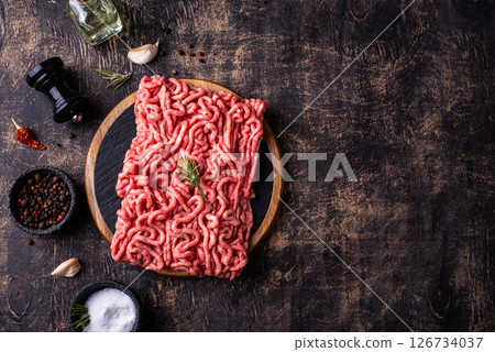 Raw minced meat on dark background 126734037