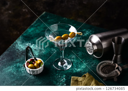 Traditional martini cocktail with olives and Traditional martini cocktail with olives and 126734085