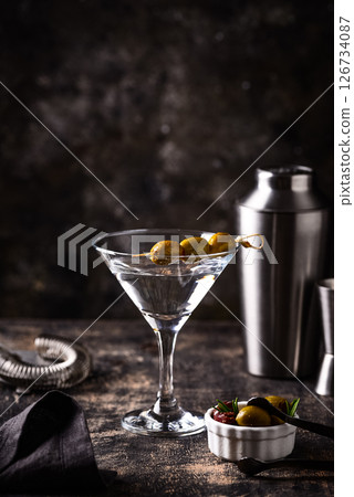 Traditional martini cocktail with olives and Traditional martini cocktail with olives and 126734087