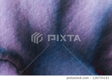 Abstract watercolor blending dark blue and purple hues in soft strokes on textured paper Abstract watercolor blending dark blue and purple hues in soft strokes on textured paper 126734181