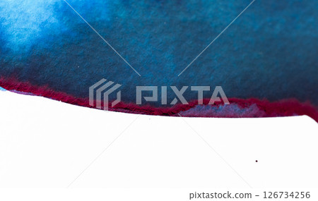 Watercolor blend of blue and red creating a striking abstract design on paper 126734256