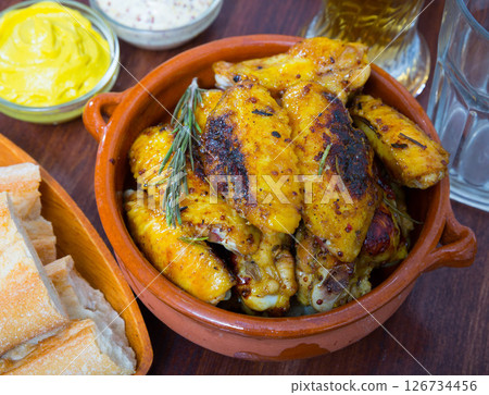 Roasted chicken wings in clayware Roasted chicken wings in clayware 126734456