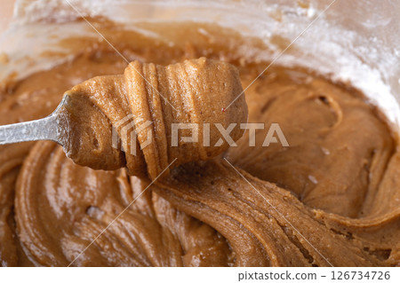 Thick Gingerbread Dough Being Lifted Close-Up Texture 126734726