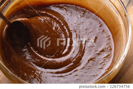Swirling Gingerbread Cookie Batter in Bowl Baking Process Macro Swirling Gingerbread Cookie Batter in Bowl Baking Process Macro 126734756