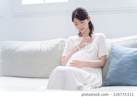 Young pregnant woman with morning sickness in late pregnancy Young pregnant woman with morning sickness in late pregnancy 126735311