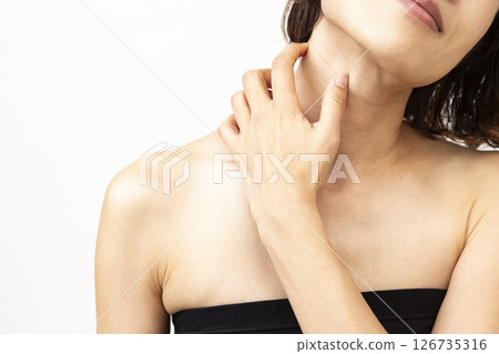Woman suffering from itchy neck Woman suffering from itchy neck 126735316