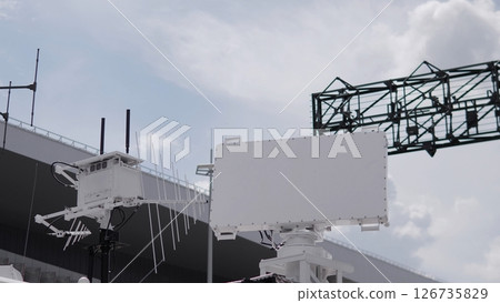 Advanced Radar System Operates Under a Cloudy Sky at a Testing Facility, Demonstrating Technology for Tracking and Monitoring Advanced Radar System Operates Under a Cloudy Sky at a Testing Facility, Demonstrating Technology for Tracking and Monitoring 126735829
