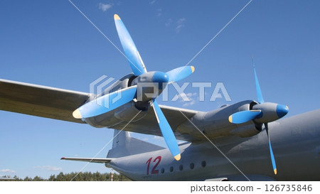 Close-up View of a Vintage Aircraft Propeller Against a Bright Blue Sky at an Airshow Event in Summer Close-up View of a Vintage Aircraft Propeller Against a Bright Blue Sky at an Airshow Event in Summer 126735846