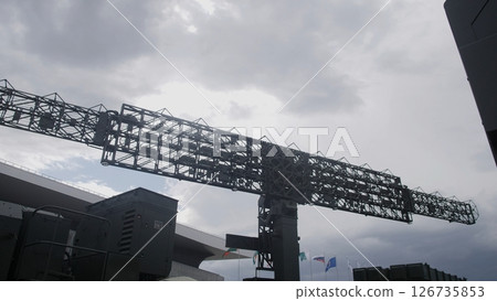 Radar Equipment Stands Against a Cloudy Sky at a Monitoring Station Near the Airport During an Overcast Afternoon Radar Equipment Stands Against a Cloudy Sky at a Monitoring Station Near the Airport During an Overcast Afternoon 126735853
