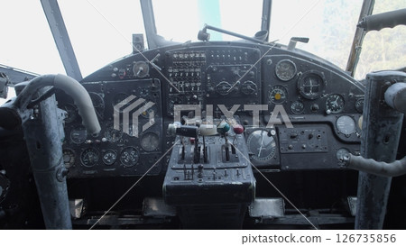 Detailed Cockpit View of a Vintage Aircraft Showcasing Numerous Gauges and Controls During a Bright Afternoon in an Aviation Museum Exhibit 126735856