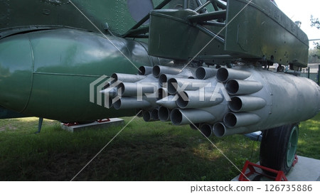 Helicopter Rocket Pod Displayed Outdoors, Showcasing Military Aviation Technology With a Focus on Missile Launch Capabilities and Engineering Design Elements 126735886