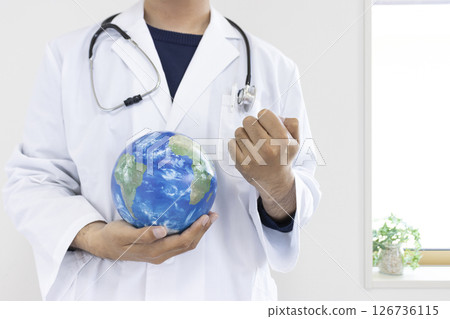 Image of a doctor pumping his fist while holding a globe (Japanese, male, no face, 30s) Image of a doctor pumping his fist while holding a globe (Japanese, male, no face, 30s) 126736115
