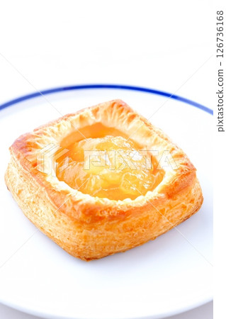 A delicious apple danish made with plenty of stewed apples A delicious apple danish made with plenty of stewed apples 126736168