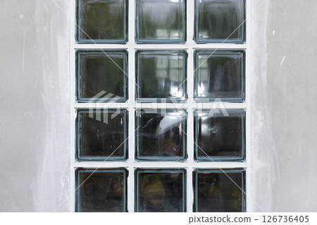 Clear glass block and concrete wall. Clear glass block and concrete wall. 126736405