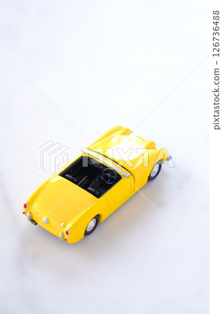 Image of a two-seater open-top car enjoying a free-spirited road trip Image of a two-seater open-top car enjoying a free-spirited road trip 126736488