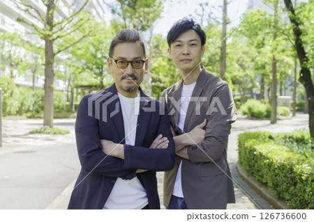 Portrait of a middle-aged man standing in a residential area 126736600