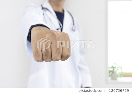 Image of a doctor punching (Japanese, male, no face, 30s) Image of a doctor punching (Japanese, male, no face, 30s) 126736769
