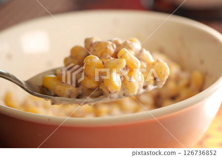 Creamy corn dish served in a rustic bowl 126736852