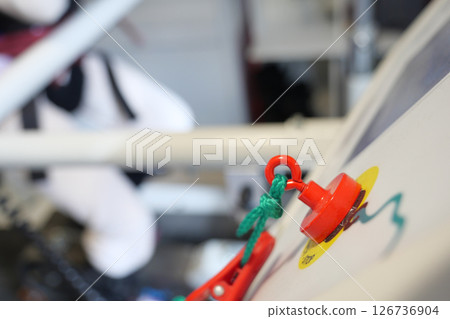 Safety latch in use on gym equipment during workout session Safety latch in use on gym equipment during workout session 126736904