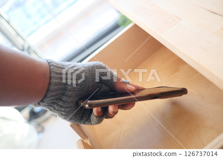 staling smart phone from a drawer  126737014