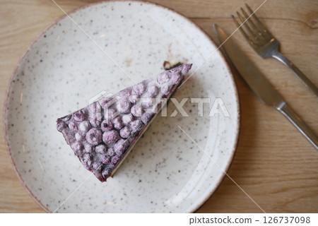 Delicious berry cake served on a rustic dinner plate Delicious berry cake served on a rustic dinner plate 126737098