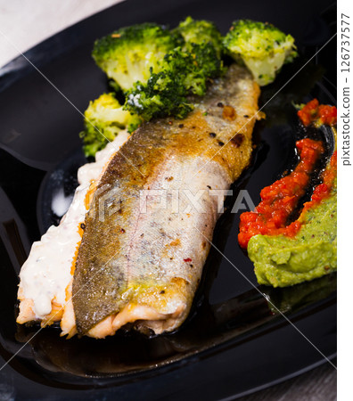 Grilled trout with broccoli and tartar 126737577