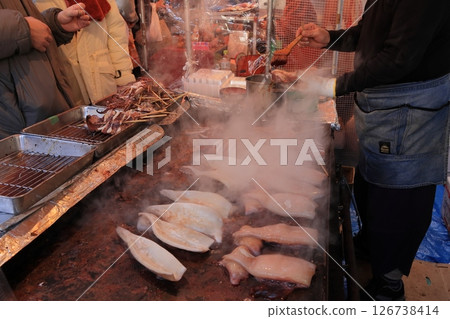 A large grilled squid stall. Steaming grilled squid 126738414