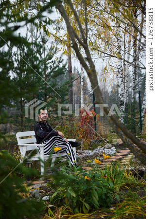 A Contemplative Moment in the Vibrant Autumn Garden of the Urban Backyard, Beauty Awaits 126738815