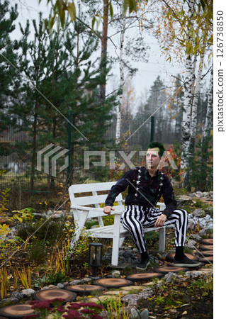 A Contemporary Fashion Portrait Set Against a Serene and Tranquil Garden Environment A Contemporary Fashion Portrait Set Against a Serene and Tranquil Garden Environment 126738850
