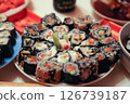 table with a set of rolls and sauce 126739187