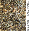 Fallen leaves and wood chips scattered all over the place 126739962