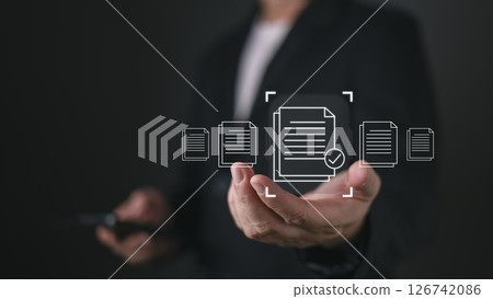 A person holds a smartphone while virtual icons of documents with a checkmark appear, symbolizing quality assurance, client focused services, and efficient document handling in a digital workflow. 126742086