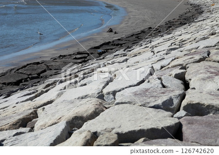 A stone-paved embankment paved with large stones 126742620