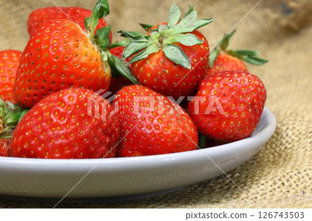 fresh ripe strawberries on a plate 126743503