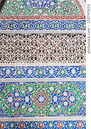 background of painted carved wooden celling with traditional Uzbek ornaments and oriental patterns in Tashkent in Uzbekistan 126743828