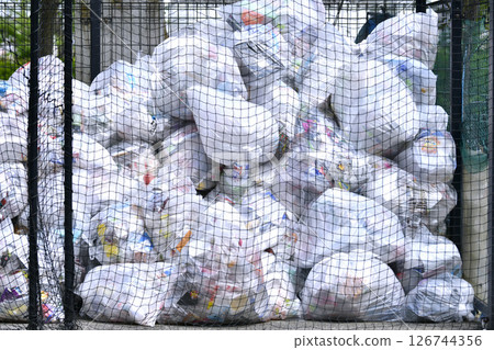 Yokohama cityscape, Japan. May. Collection day for plastic containers and packaging. Mountains of garbage piled up in the city. 126744356
