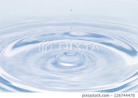 Drops of water falling on the surface of the water. 126744470