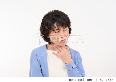 Senior woman suffering from sore throat Senior woman suffering from sore throat 126744558