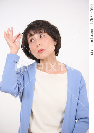 Senior woman suffering from hair problems Senior woman suffering from hair problems 126744596