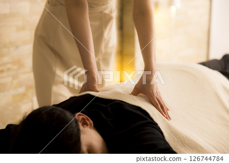 Man receiving massage at beauty salon Man receiving massage at beauty salon 126744784