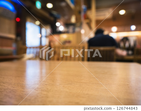 Table top wooden counter Bar with people restaurant interior Blur background 126744843