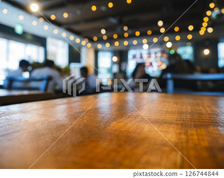 Table top wooden counter Bar with people Cafe restaurant interior Blur background 126744844