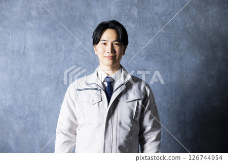 Men in work clothes with arms folded 126744954