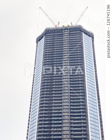 Exterior of a tower apartment building under construction in Tokyo 126745196