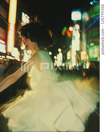 Woman dancing in the city 126745508