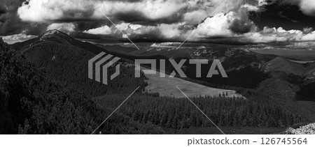 The valley's surrounding deep forest creates a feeling of isolation and natural absorption. The valley's surrounding deep forest creates a feeling of isolation and natural absorption. 126745564
